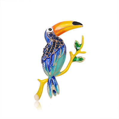 Front product view of the parrot brooch pin in blue and yellow