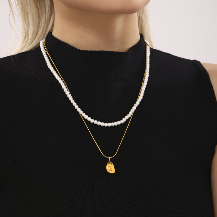 Gold Steel Teardrop Pendant Necklaces and White Shell Pearl Strand