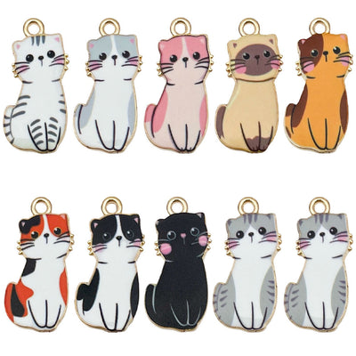 Colorful cat charms arranged on a light background