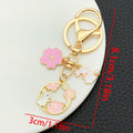Thirteen Pink Rabbit Blossom Wreath Metal Keychain Designs view 11
