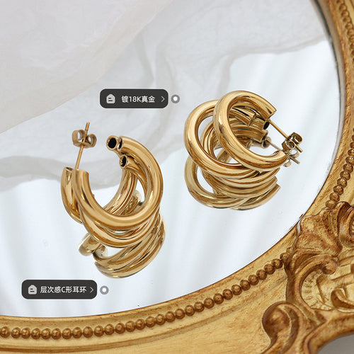 Gold triple-layer C-hoops on mirror with plating and style labels