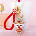 Jeweled Wealth Deity Baby Keychain in Plain and Red Fortune Loop Styles view 1
