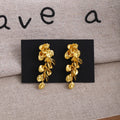 Gold Tone Leaf and Flower Cascade Long Stud Earrings view 1