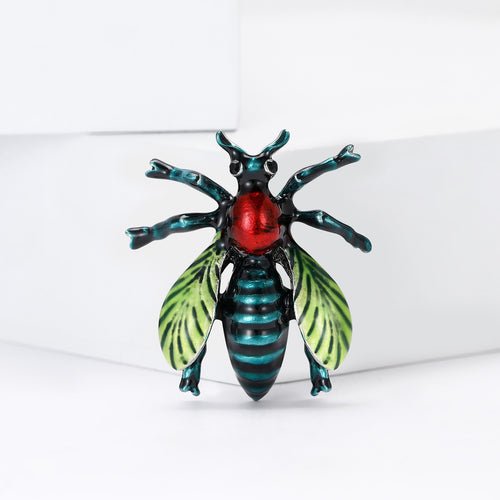 Colorful Enamel Beetle Brooch with Red Body and Green Wings front view on a white background
