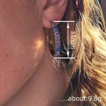 Gold Tone Wide Hoop Earrings With Blue Floral Pattern Inlay view 4