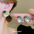 Mixed Metal Floral Stud Earrings With White Pearl Centers view 2