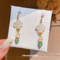 White Flower and Green Bead Hook Earrings Statement Jewelry view 1