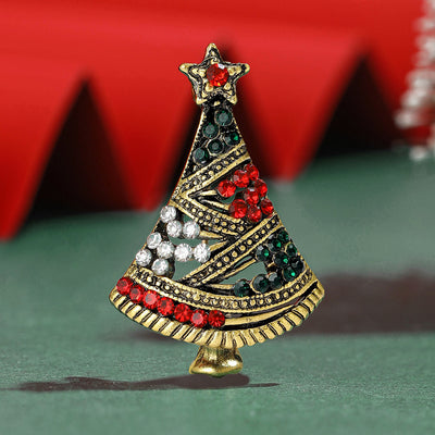 Antique Gold Christmas Tree Brooch shown against a white display background