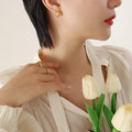 Small Polygonal Hollow Faceted Stud Earrings Gold Steel view 4