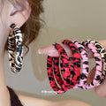 Animal Print Fabric Hoop Earrings In Three Colors With Fabric Wrapped Hoops view 1