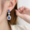 Deep Blue Oval And Pear Floral Halo Long Earrings In Silver Tone view 2