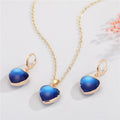 Gold Tone Heart-Shaped Blue Evil Eye Necklace and Huggie Earrings view 4