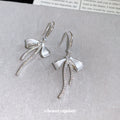 Silver Bow Hook Earrings in Polished Statement Design view 2
