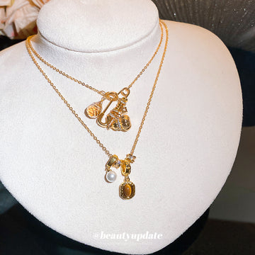 Gold Tone Oval Pearl Charm Necklaces With Decorative Accents