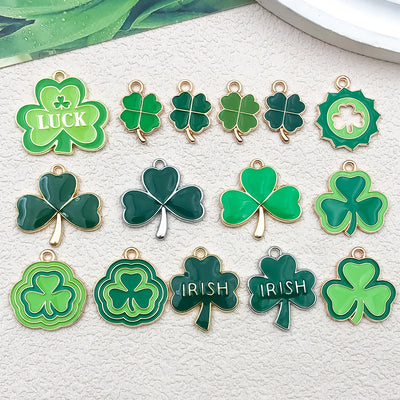 Metallic clover charms arranged on a light background