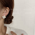White Camellia Flower Stud Earrings Gold Rim Shell Finish view 3