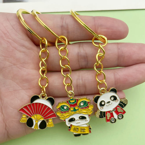 Image 2 showing a person holding two pandas in their hands.