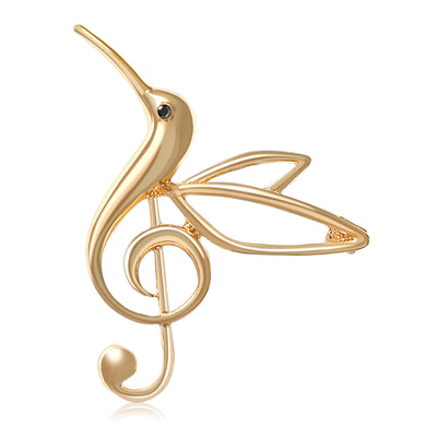 Gold tone hummingbird treble clef brooch front studio view