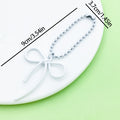 Butterfly Charm Keychains Featuring Magenta Bow Across 17 Pictured Variations view 11
