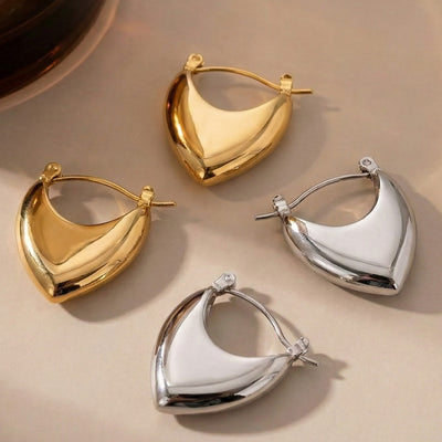 Gold and steel polished heart shield hoop earring pairs on white