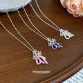 Pastel Flower and Butterfly Pendant Necklaces in Three Colors view 2