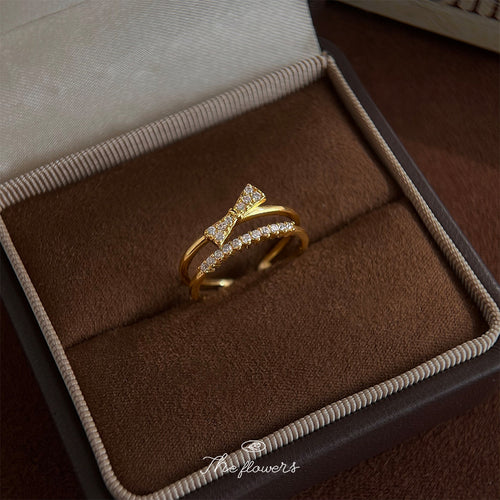 Gold bow crystal open ring in brown jewelry box