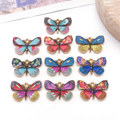 Colorful butterfly charms arranged on a light background