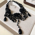 Black Beaded Floral Bib Necklace With Graduated Teardrop Fringe view 6
