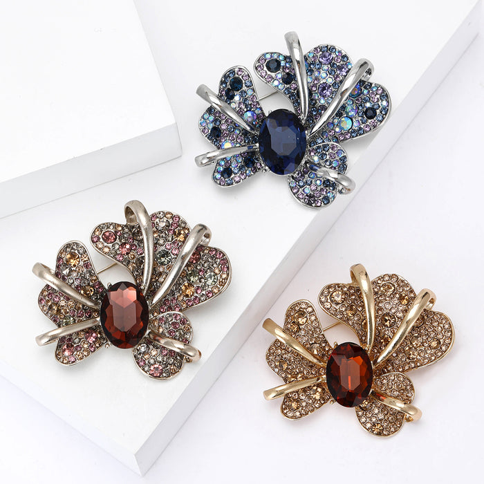 Iris Flower Brooch in Metal with Crystal Petals and a Faceted Center