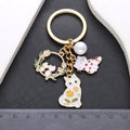 White Cat Heart Flower Wreath and Pearl Enamel Keychain view 4