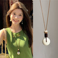 Brown Cord White Bi Disc Pendant Necklace Wood Lotus Bead view 1