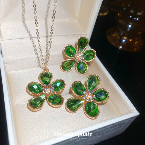 Green crystal flower necklace and studs in cream jewelry box