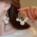 Gold Tone Hoop Earrings with Graduated White Pearls view 2
