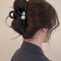 Black Sculptural Loop Hair Claw With Pearl Like Orb And Clear Crystal view 3