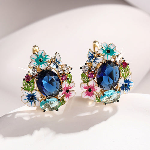 Closer front view of floral blue center studs with butterflies