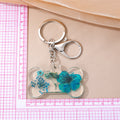 Silver Tone Dog Bone Pressed Flower Resin Keychains view 5