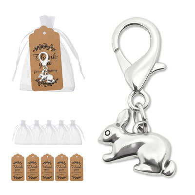 Packaging overview shows the silver-tone sitting rabbit clasp charm with an organza bag and kraft tags.