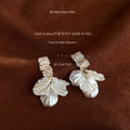 Gold Tone Clear Stone Bar And Translucent White Petal Stud Earrings view 4