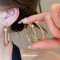 Open Oval Hoop Earrings with Crystal Accent in Silver Tone view 2