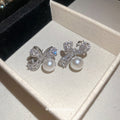 Silver Tone Crystal Bow Stud Earrings With White Pearl Drops view 4