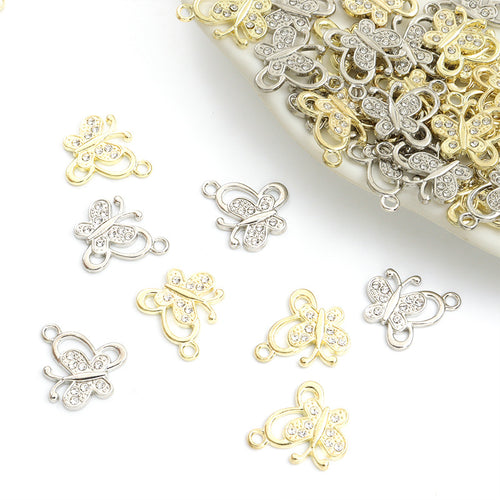 Assorted butterfly charms arranged on a white background