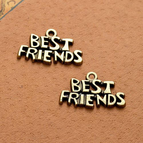 Second product image of the best friends word charm showing stacked Best Friends lettering with a small top loop