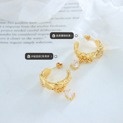 Pair of gold heart C-hoops with crystal drops and brass labels