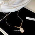 Gold Tone Oval White H Letter Charm Pendant Necklace view 4