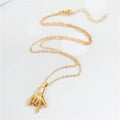 Gold Tone Hand Gesture Pendant Necklaces in Two Distinct Designs view 5