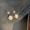 White Pearl Top And Gold Edged Shell Shape Drop Stud Earrings view 3