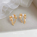 Gold Ribbon Bow Stud Earrings White Pearl Center Pair view 4