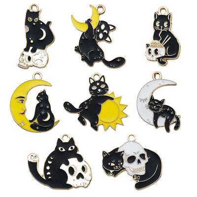Black cat charms arranged on a light background