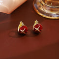 Red Enamel Four Point Star Gold Small Huggie Earrings view 1