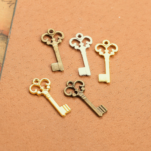 Scroll Crown Key Metal Charm shown in front detail view
